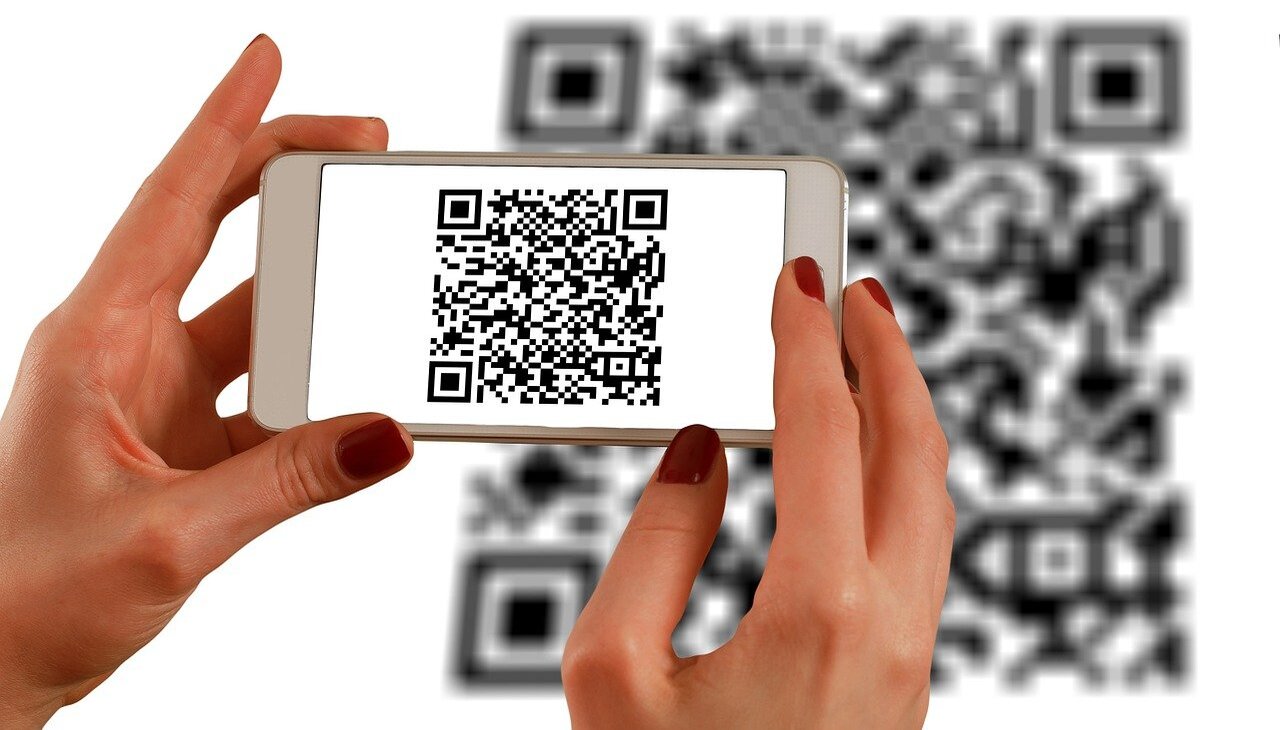 woman scans qr code with her phone.