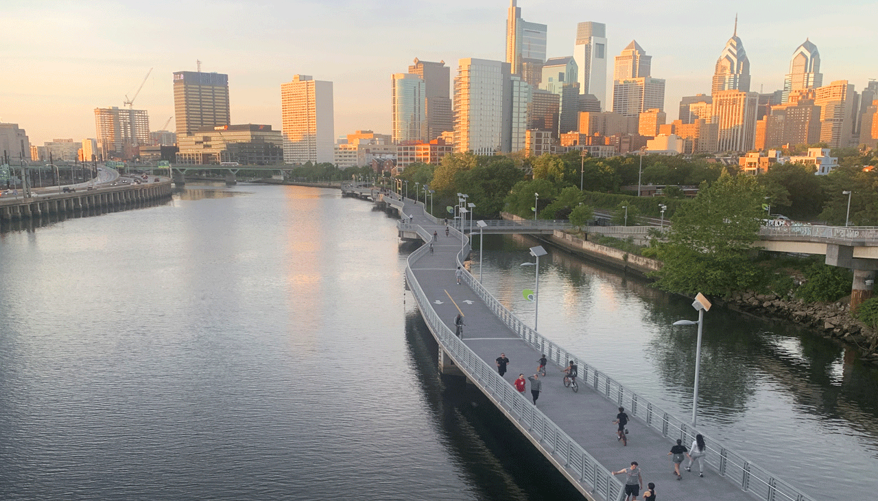 A slightly hazy City skyline from the Schuylkill River Trail at the South Street bridge.