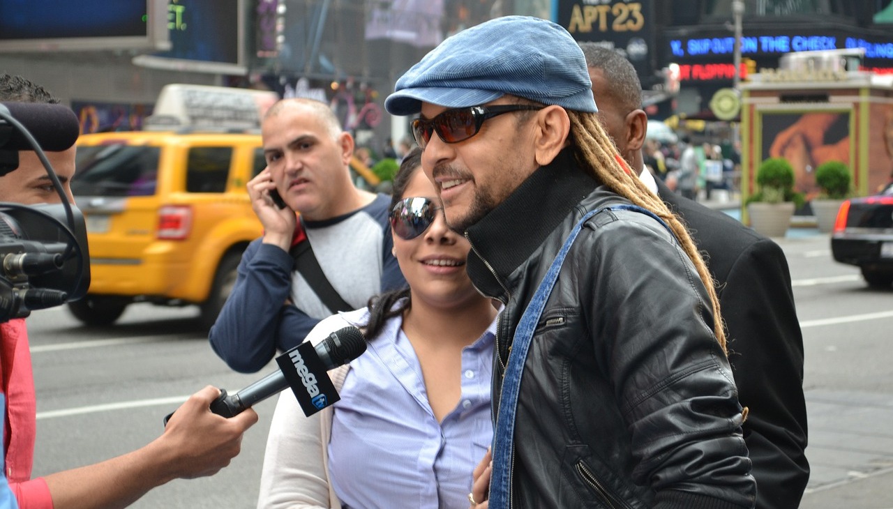 Latino man is interviewed on the street.