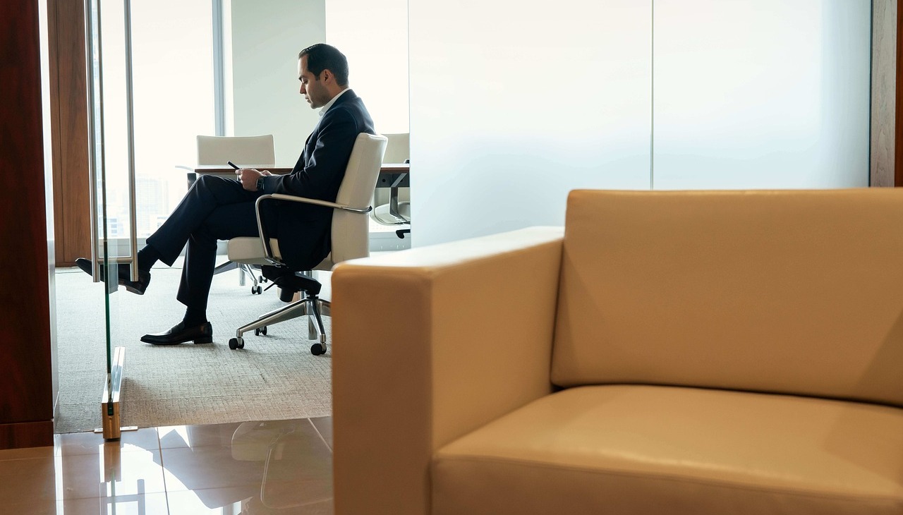 A person sitting alone on a meeting room. 