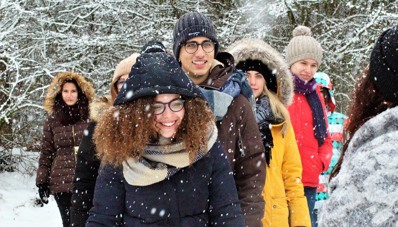 Group of young people walking on the snow