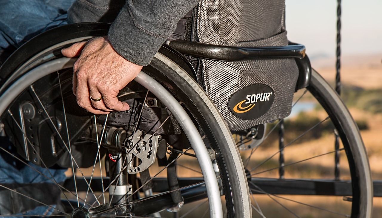 A man on a wheelchair. 