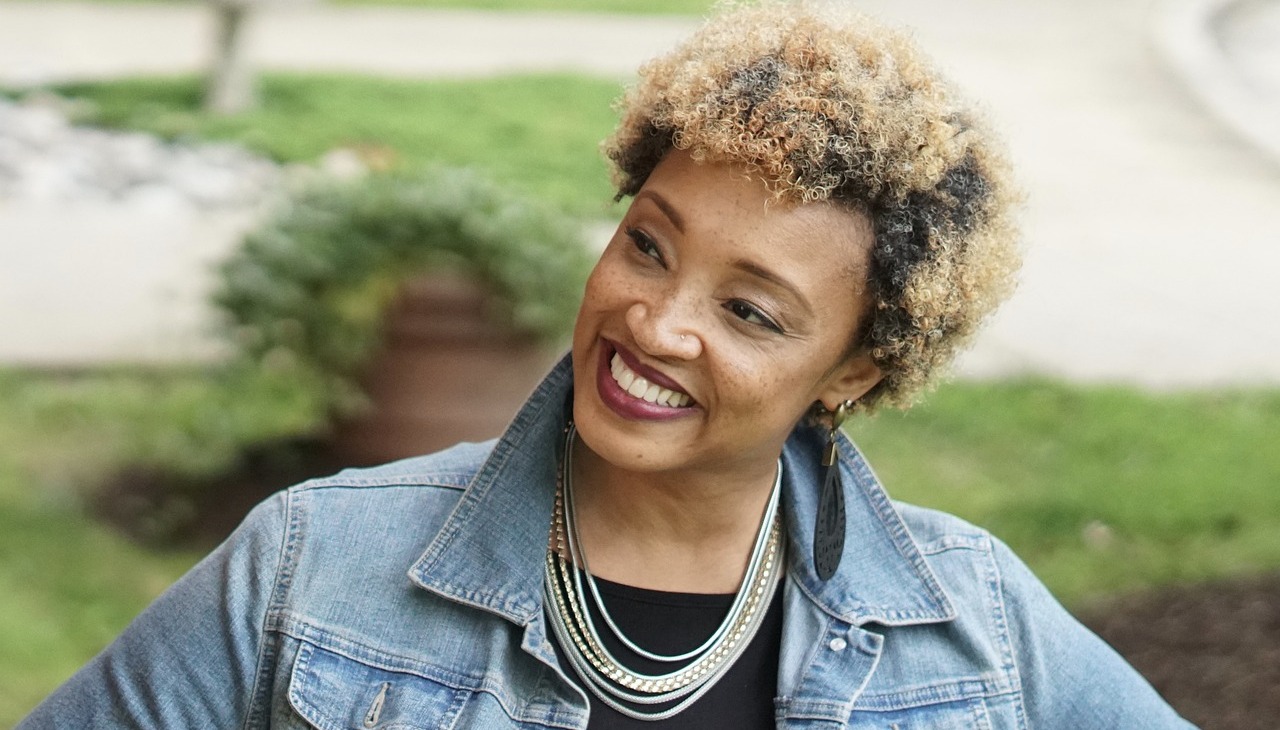 African-American woman poses smiling. 