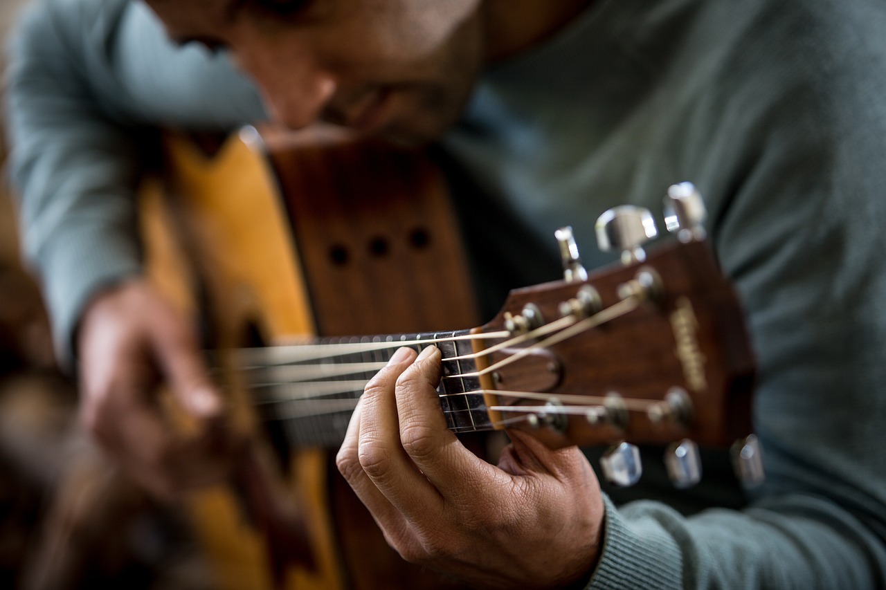 Man playing the guitar. 