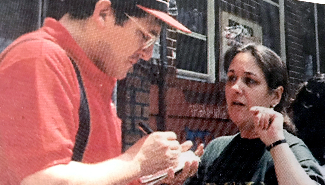 The Founder, Editor and Publisher of AL DIA in his early days interviewing a resident of North Philadelphia. Photo  AL DÍA News