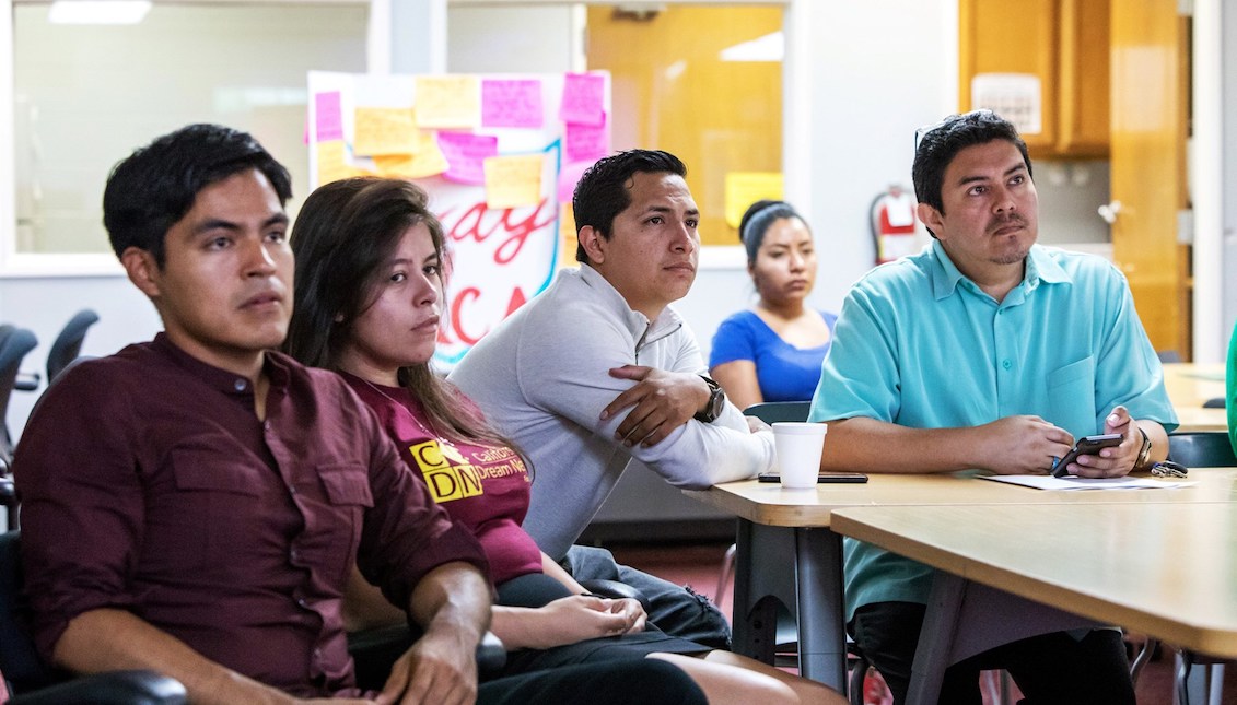 Young DACA recipients watch a screen projecting then-Attorney General Jeff Sessions' announcement on DACA at the Coalition for Humane Immigrant Rights of Los Angeles on Sept. 5, 2017.Monica Almeida / Reuters file