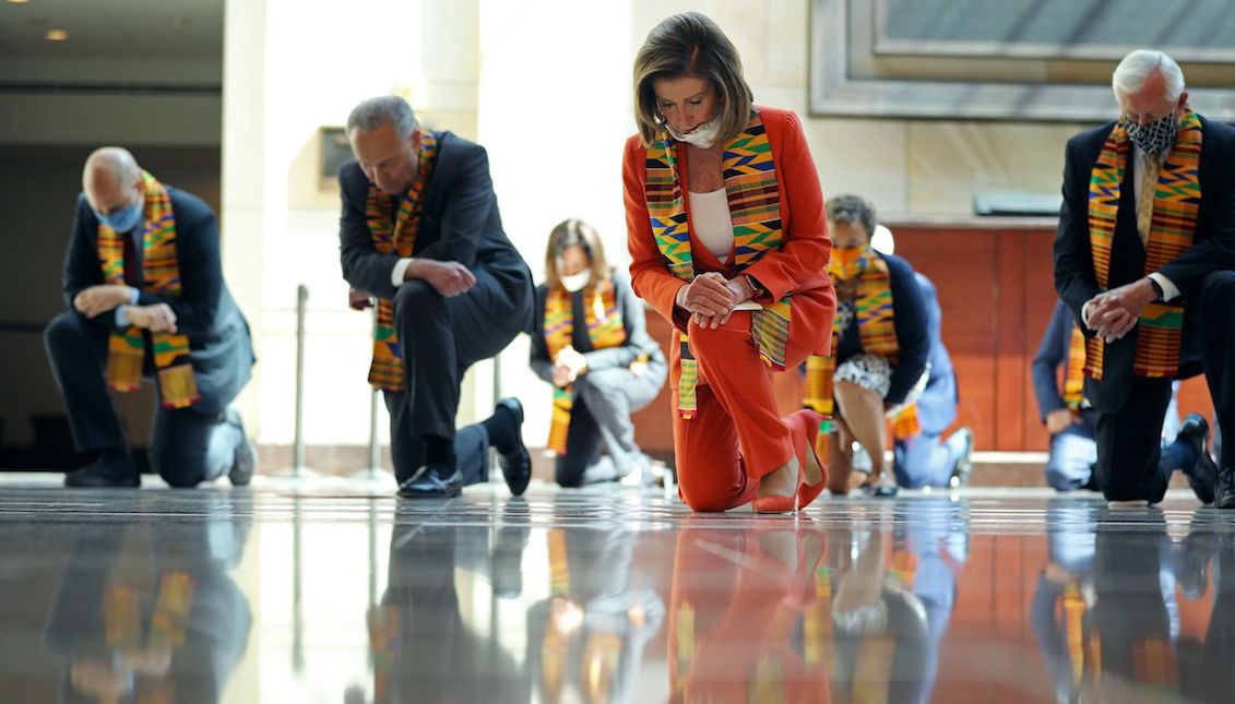 Sen. Cory Booker, Senate Minority Leader Chuck Schumer, Sen. Kamala Harris, Speaker of the House Nancy Pelosi, Rep. Karen Bass, House Majority Leader Steny Hoyer, and other congressional Democrats kneel in silence for eight minutes and 46 seconds in the US Capitol Visitor Center to honor George Floyd. Chip Somodevilla/Getty Images