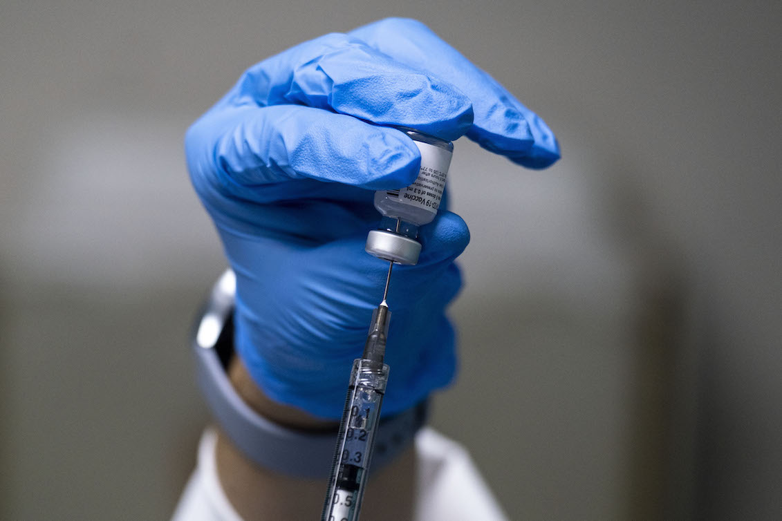 CAPTION: A dose of the Pfizer-BioNTech Covid-19 vaccine is prepared at the Ashford Medical Center in San Juan, Puerto Rico on December 15, 2020. Photo: Ricardo Arduengo/AFP via Getty Images.