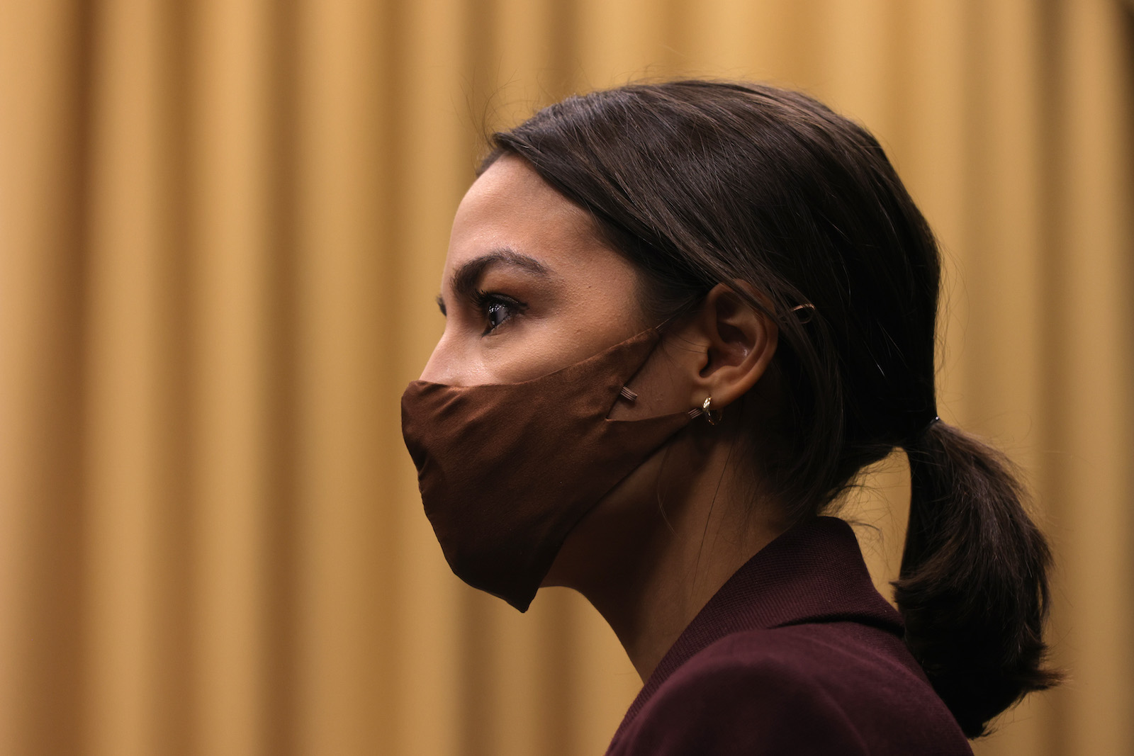 WASHINGTON, DC - MARCH 18: U.S. Rep. Alexandria Ocasio-Cortez (D-NY) listens during a news conference to introduce the "Puerto Rico Self-Determination Act of 2021" at Rayburn House Office Building on Capitol Hill March 18, 2021 in Washington, DC. Photo: Alex Wong/Getty Images