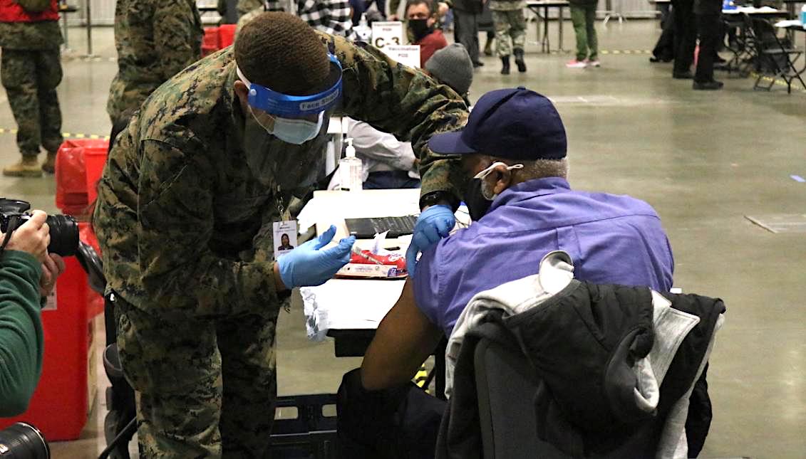 A man is administered one of the first vaccines at FEMA's mass-vaccination site in Center City. Photo: Nigel Thompson/AL DÍA News