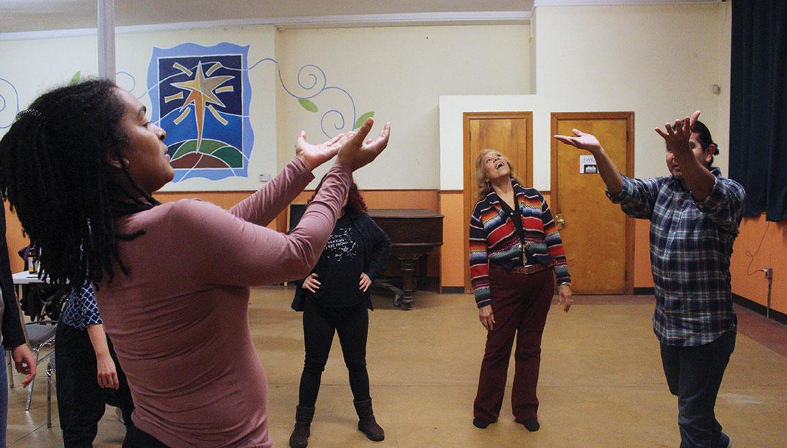 Alexandra Espinoza, Rachel O’Hanlon-Rodriquez, Virginia Sanchez, and Ivan Vila (left to right) participate in an activity during their rehearsal at West Kensington Ministry for the show, "Palante," which will be featured at the First Person Arts Festival. Photo: Emily Neil / AL DÍA News