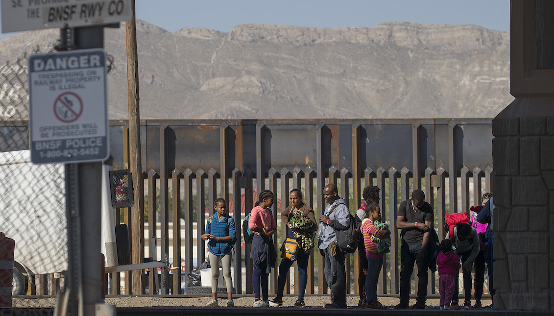 EL PASO, TX - JUNE 05: Migrants expect to be processed and loaded into a van by U.S. Border Patrol agents after being arrested when they illegally crossed to the United States from Mexico on June 5, 2019, in El Paso, Texas. (Photo by Joe Raedle/Getty Images)