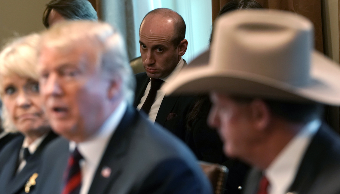 WASHINGTON, DC - JANUARY 11: Senior Advisor to the President, Stephen Miller (C) looks on as U.S. President Donald Trump hosts a round-table discussion on border security and safe communities with State, local, and community leaders in the Cabinet Room of the White House on January 11, 2019, in Washington, DC. (Photo by Alex Wong/Getty Images)
