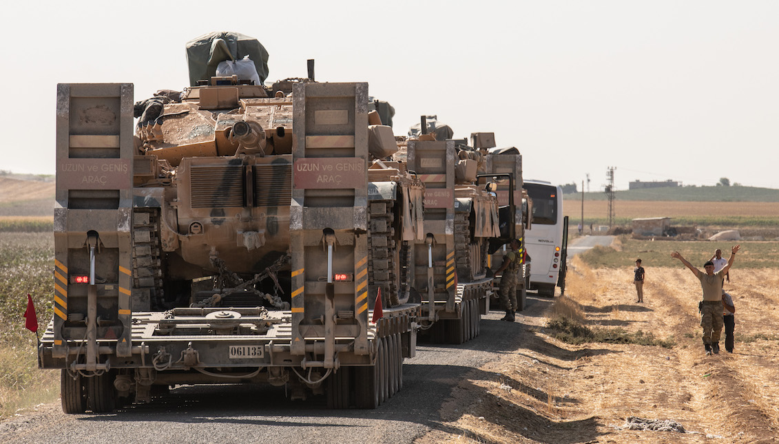 AKCAKALE, TURKEY - OCTOBER 12: Turkish soldiers secure the are as Turkish military vehicles carry tanks heads to the Syrian border on October 12, 2019 in Akcakale, Turkey. (Photo by Burak Kara/Getty Images)