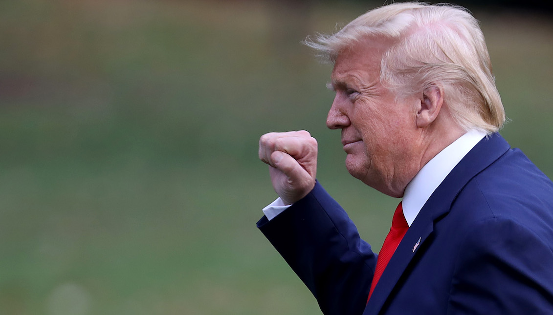 WASHINGTON, DC - October 3: U.S. President Donald Trump shows his fist when he returns to the White House on October 3, 2019 in Washington, DC. Trump traveled to Florida earlier in the day. (Photo by Win McNamee / Getty Images)
