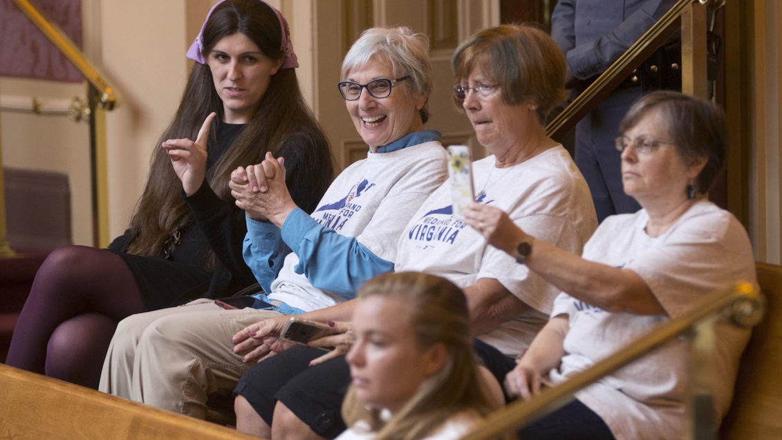 Rep. Danica Roem (D-Prince William) sits with supporters of Medicaid expansion during Wednesday’s vote. Steve Helber/AP