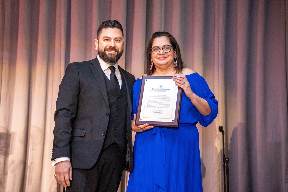 Jose Aguirre presents a congressional proclamation to Congreso, on behalf of Congressman Brandon Boyle. Photo: Peter Fitzpatrick.